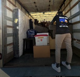 Happy Move crew member loading a moving truck